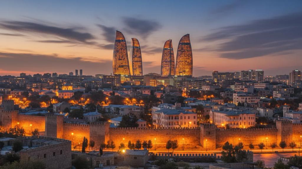 Baku Flame Towers glowing at dusk behind the walled Old City